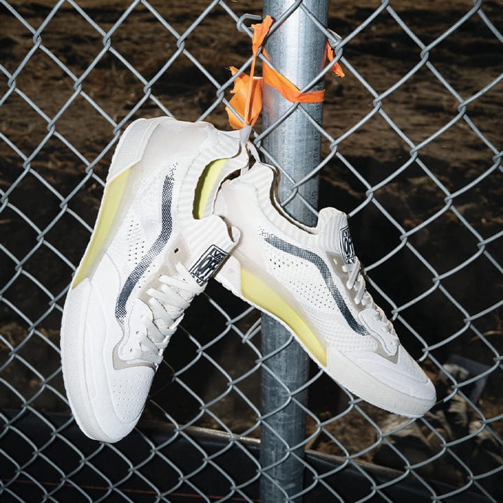Vans AVE 2.0 skate shoes tied to a fence