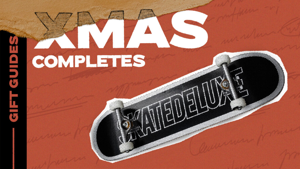 Christmas skateboard completes banner with skatedeluxe outline deck, white festive lettering, and vertical "GIFT GUIDES" text on the left.