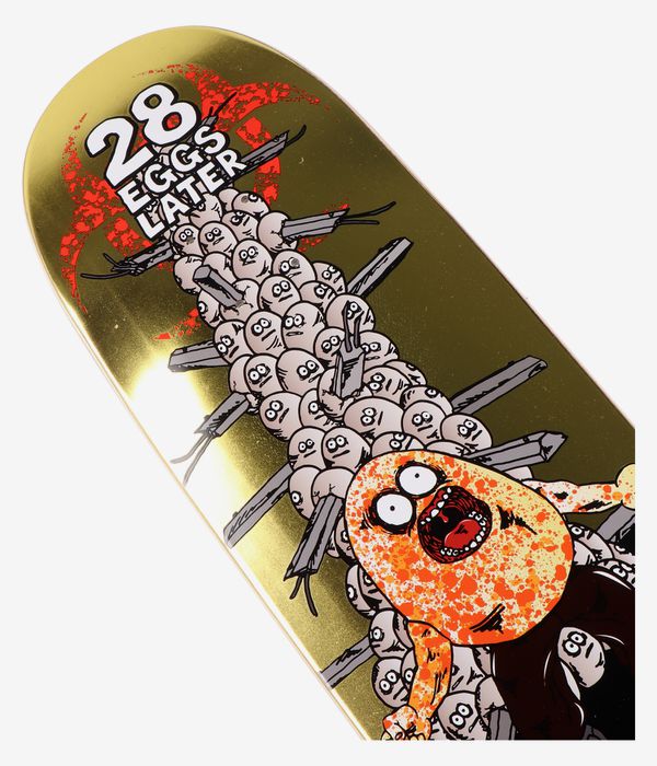 Cropped detail view of Heroin Skateboards 28 Eggs Later 9" skateboard deck showing metallic gold surface with bold cartoon graphic: stacked white/cream egg characters, orange-speckled grotesque figure, red splatter and white text “28 Eggs Later”. Clean studio image; white background.