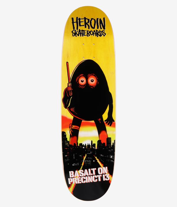 Heroin Skateboards Basalt On Precint 13 Egg 8.75" Skateboard Deck, full bottom view: yellow wood-toned deck with bold black egg-shaped cartoon character with red-orange eyes, skyline silhouette and white “Basalt On Precinct 13” text. Clean Studio image; white background.
