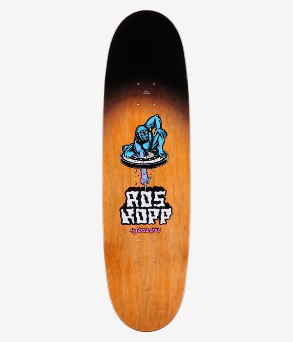 Santa Cruz Roskopp Screaming Arm Pro 9" Skateboard Deck, full top view: beige wood-grain deck with central bold cartoon blue creature dripping pink/purple above stylized 'Ros Kopp' and 'by Santa Cruz' text. Clean Studio image; white background.
