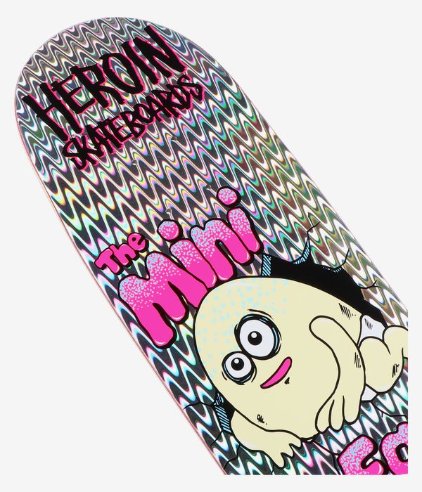 Cropped detail view of Heroin Skateboards Mini Egg Holographic 8.38" skateboard deck: white deck with holographic wavy swirl pattern, large rounded cartoon egg character, pink “The Mini” text and black “Heroin Skateboards” logo. Clean studio image; white background.