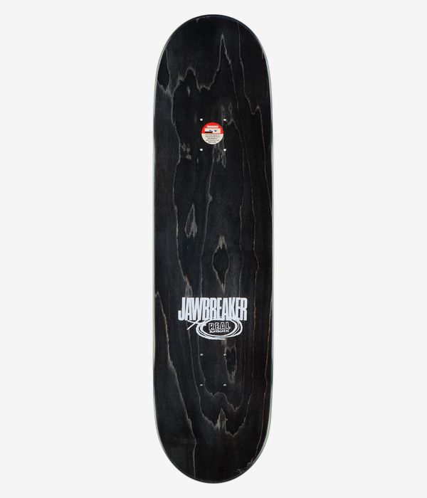Real Silva Jawbreaker Unfun 8.28" Skateboard Deck, full top view: black stained wood-grain surface with centered white "Jawbreaker" wordmark and smaller oval "Real" logo; small circular sticker near top. Clean studio image; white background