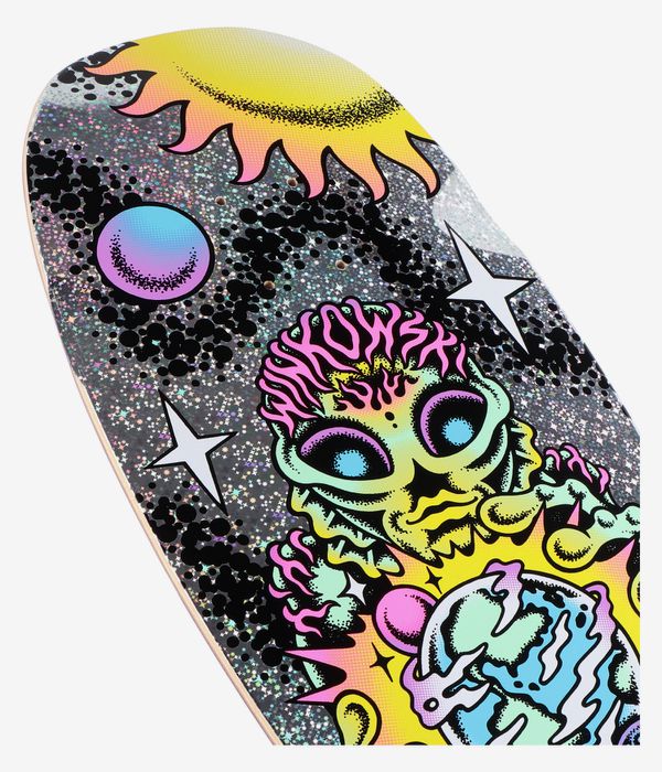 Cropped detail view of Santa Cruz Winkowski Cosmic Pro Shaped 10.35" skateboard deck: sparkly grey background with black speckle, cartoon neon alien head in yellow/pink/turquoise, white stars and yellow sun, 'WINKOWSKI' text; clean studio image; white background