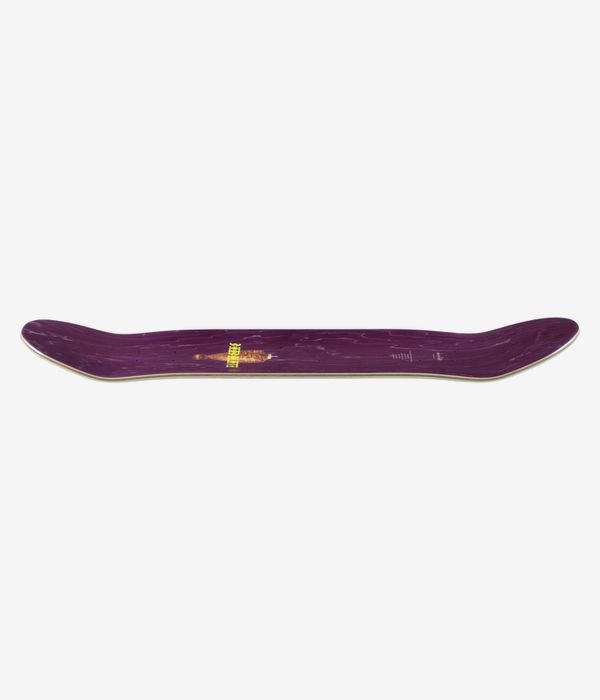 Planche de skateboard « Chocolate Herrera Trompo » de 8,5 pouces : vue de profil sur toute la longueur montrant le concave avec le nose et le tail, face supérieure peinte principalement en violet, petit logo jaune au centre et bord en contreplaqué apparent. Image studio nette ; fond blanc